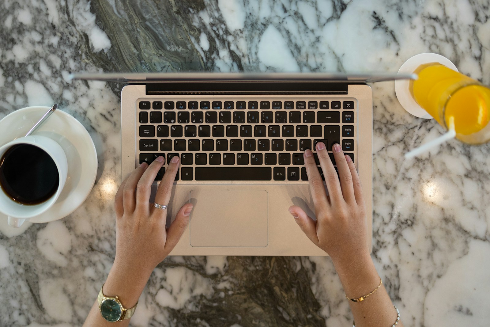 hands holding a laptop